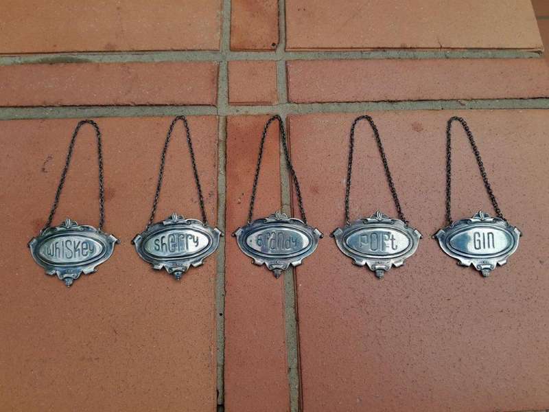 A Mid 20th Century Set of Five Sterling Silver Decanter Labels Brandy Port Sherry Gin Whisky  We...