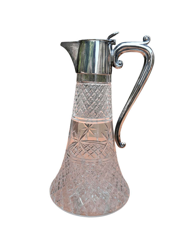 An Antique Crystal and Silver Plated Claret Jug