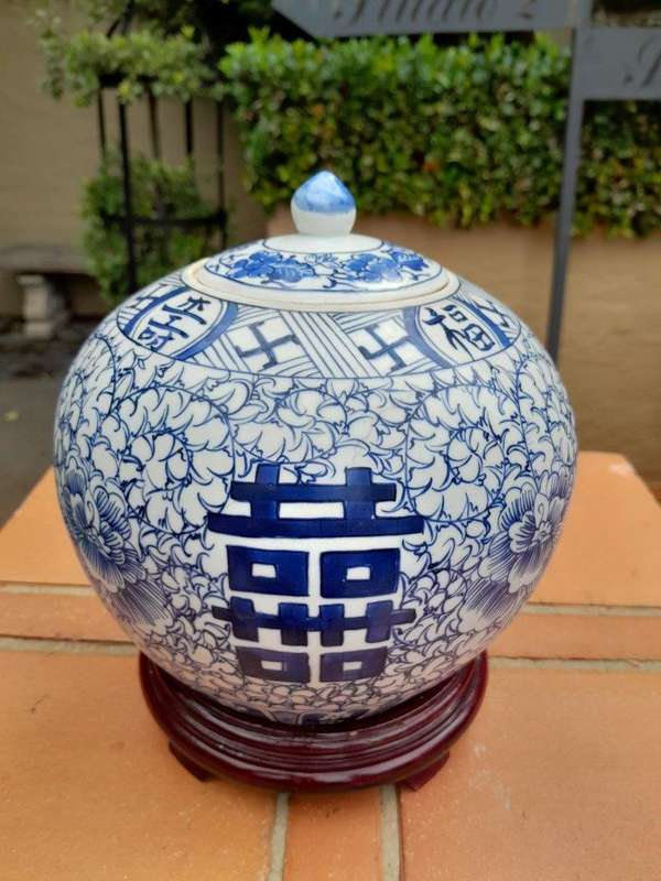 A Blue and White Porcelain Chinese Lidded Jar on Wooden Stand