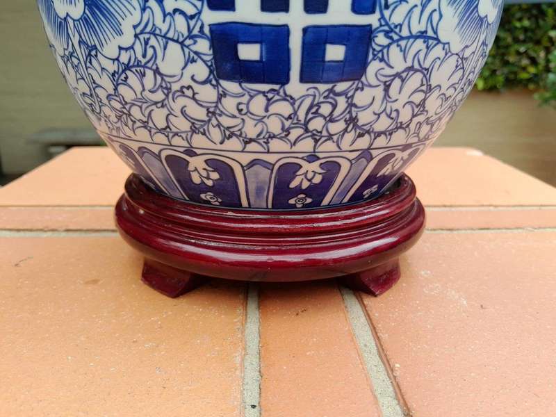 A Blue and White Porcelain Chinese Lidded Jar on Wooden Stand