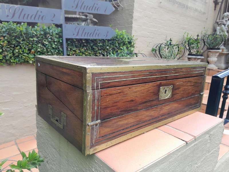 An Antique Victorian Rosewood Writing Slop with Leather Inside and Brass Hardware has Lock and Key