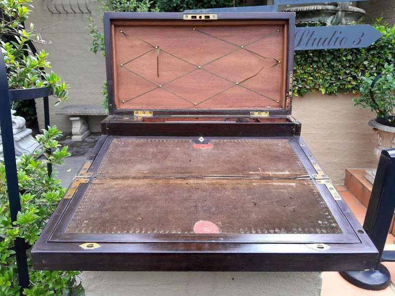 An Antique Victorian Rosewood Writing Slop with Leather Inside and Brass Hardware has Lock and Key