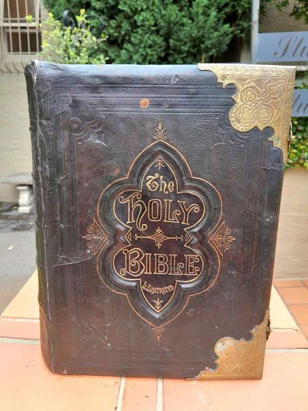 An Antique 19th Century English Leather Bound Bible with Brass Corners