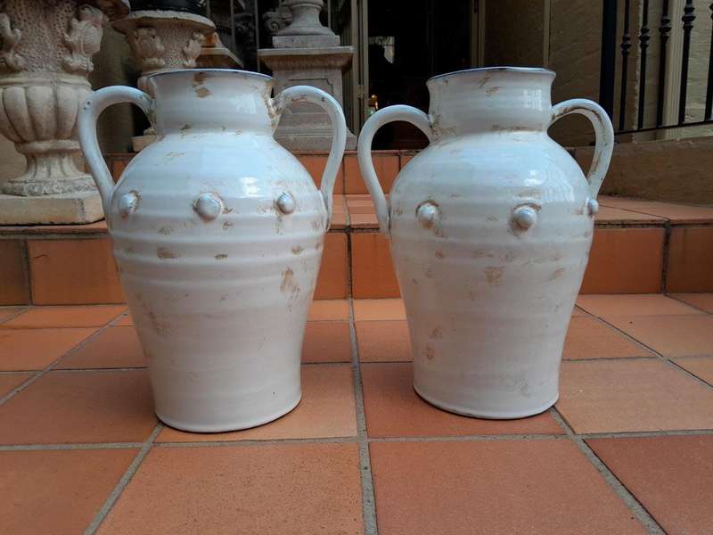 A Pair Of Large Ceramic Urns With Two Handles
