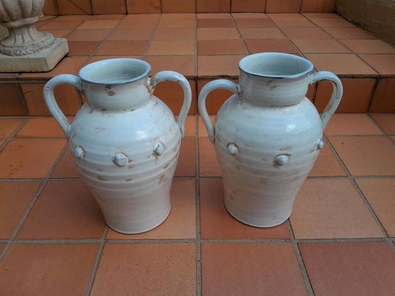 A Pair Of Large Ceramic Urns With Two Handles