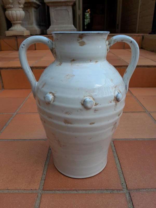 A Pair Of Large Ceramic Urns With Two Handles