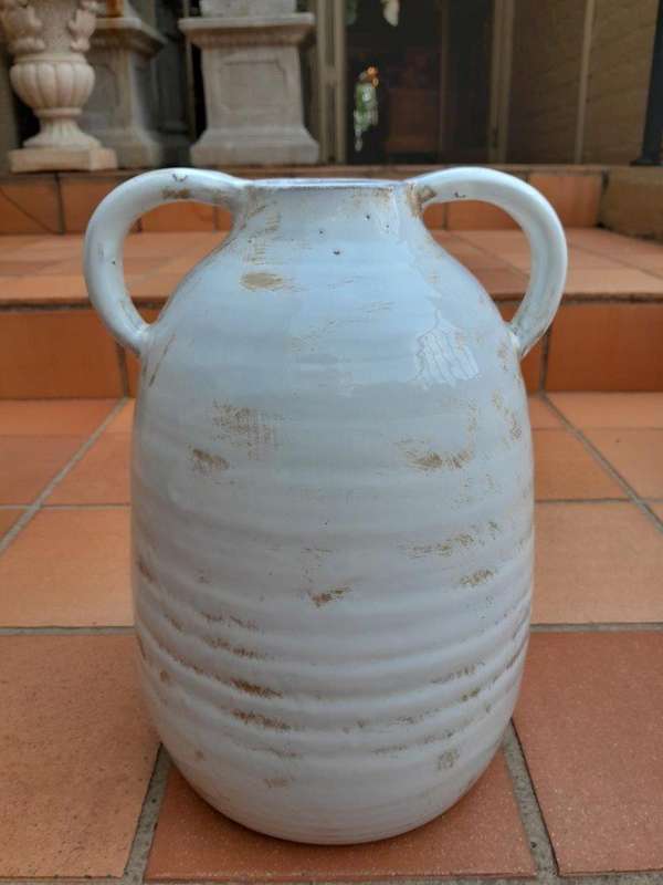 A Pair Of Ceramic Urns With Two Handles