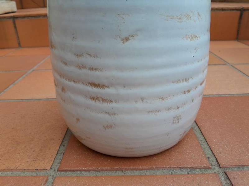 A Pair Of Ceramic Urns With Two Handles