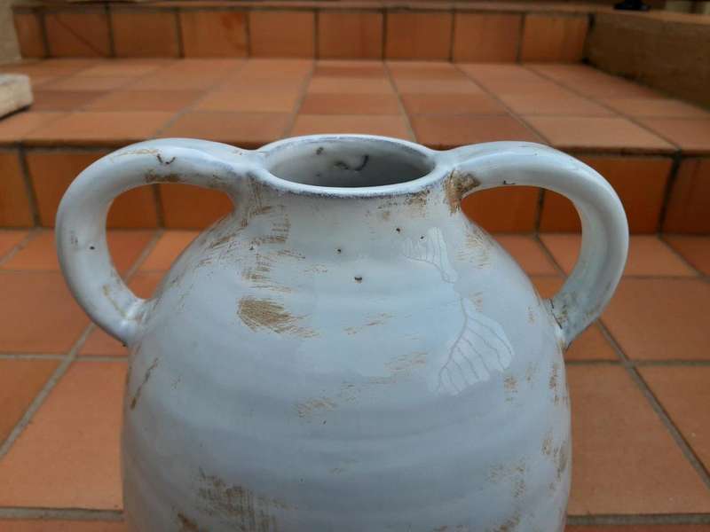 A Pair Of Ceramic Urns With Two Handles