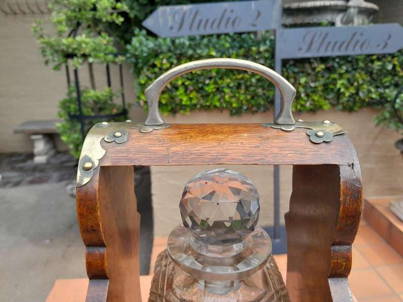 An Antique Victorian Tantalus With A Crystal Decanter And Key