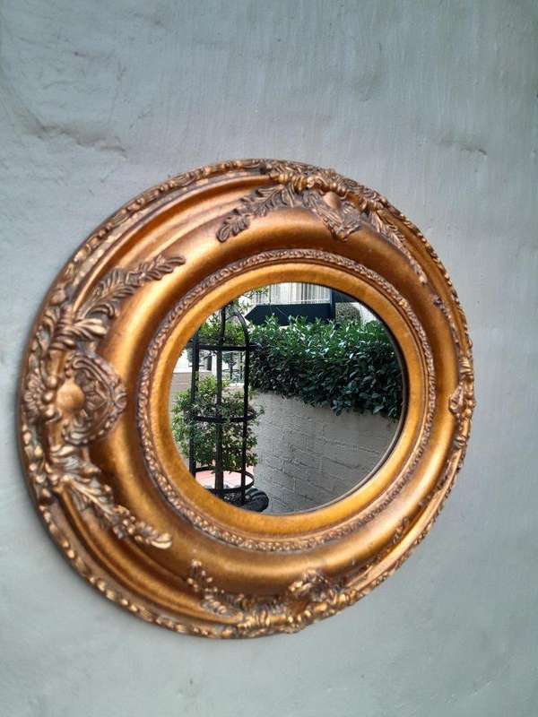 A French Style Carved Oval Giltwood Mirror