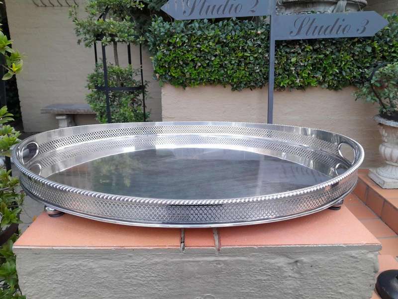 An Early 20th Century Silver-Plate Gallery Tray On Bun Feet