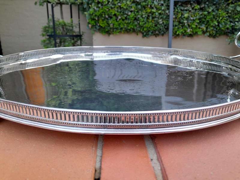 An Early 20th Century Silver-Plate Gallery Tray On Bun Feet