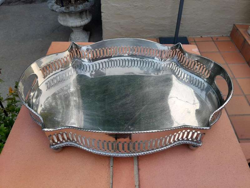 A Silver-Plate Gallery Tray On Bun Feet