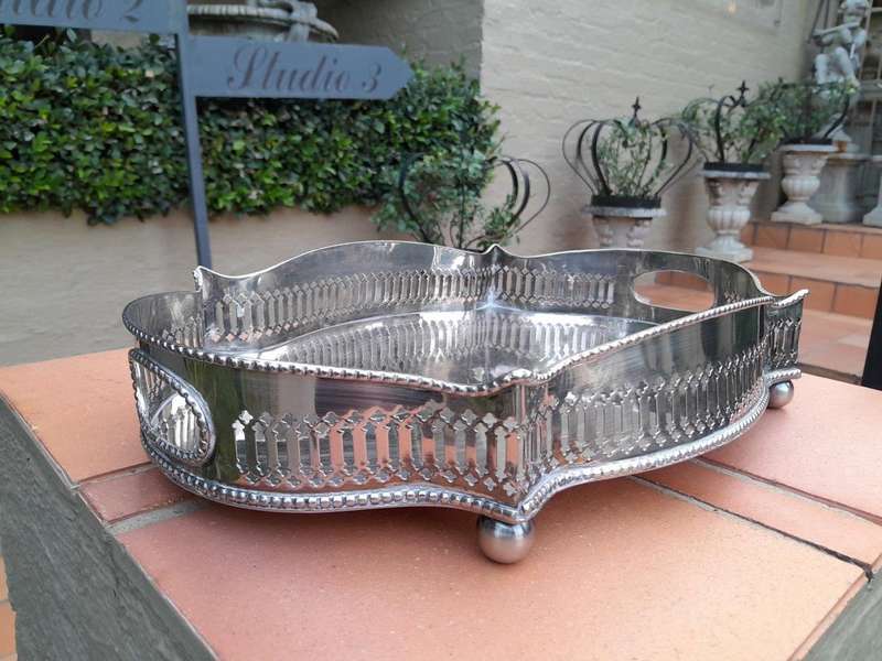 A Silver-Plate Gallery Tray On Bun Feet