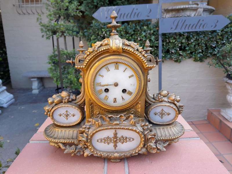 An Antique 19th Century French Gilt Metal Clock With Pendulum And Key In Working Condition
