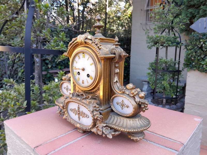 An Antique 19th Century French Gilt Metal Clock With Pendulum And Key In Working Condition