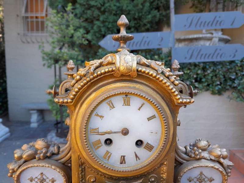 An Antique 19th Century French Gilt Metal Clock With Pendulum And Key In Working Condition