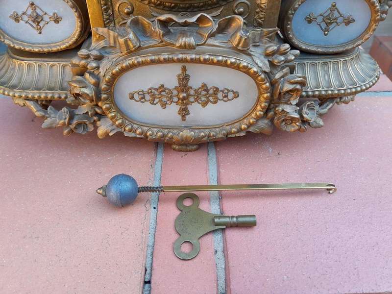 An Antique 19th Century French Gilt Metal Clock With Pendulum And Key In Working Condition