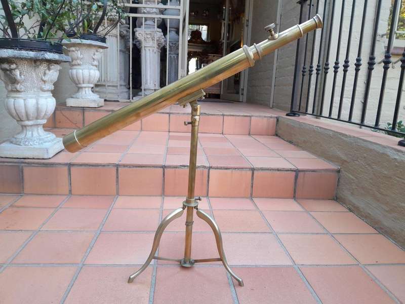An Antique Brass Table Top Telescope On Tripod Base