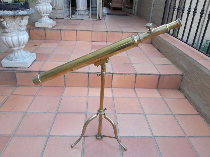 An Antique Brass Table Top Telescope On Tripod Base