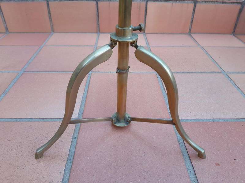 An Antique Brass Table Top Telescope On Tripod Base