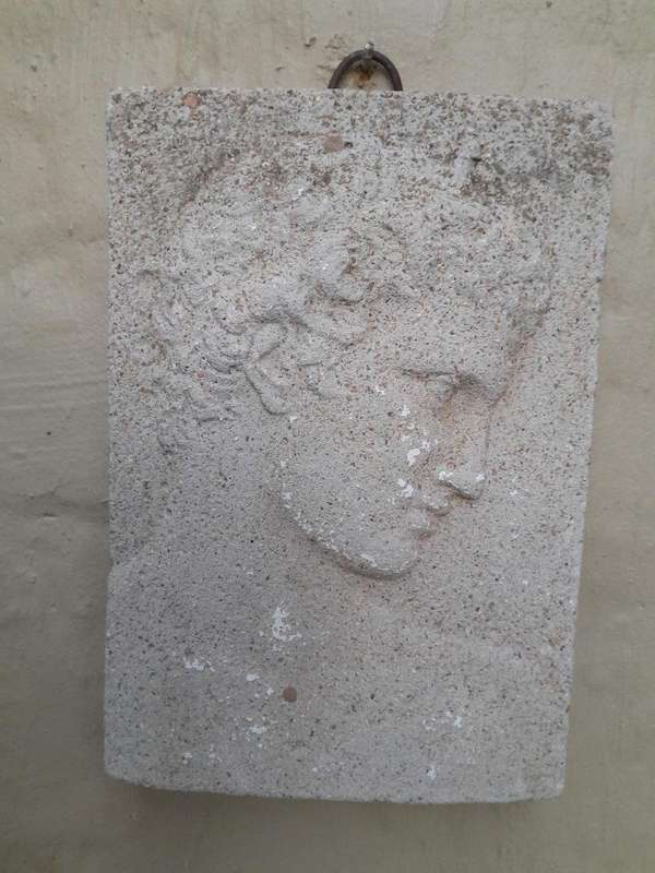 A Concrete Relief Plaque Sculpture With A Raised Bust Depiction