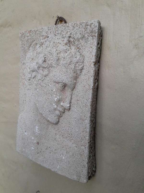 A Concrete Relief Plaque Sculpture With A Raised Bust Depiction