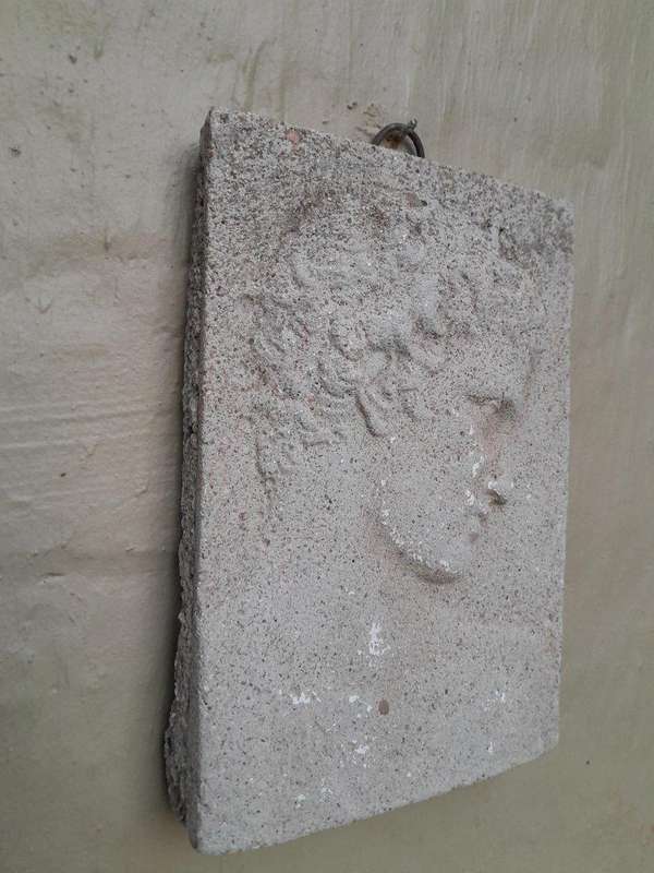 A Concrete Relief Plaque Sculpture With A Raised Bust Depiction