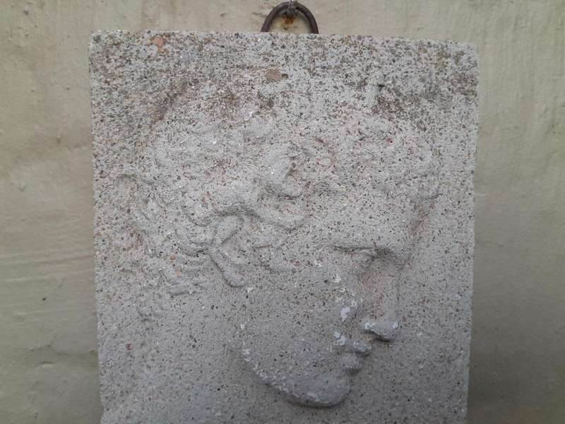 A Concrete Relief Plaque Sculpture With A Raised Bust Depiction