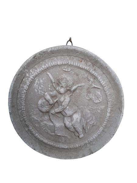 A Concrete Relief Round Sculpture Of An Ornate Cherub Plaque