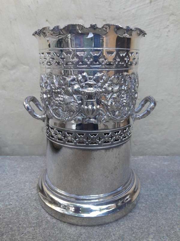 A Silver-Plate Wine Bottle Holder With Two Handles