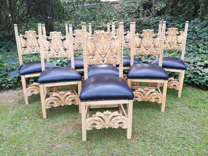 A 20th Century Set of Eight Carved and Bleached Oak Dining Chairs Upholstered in Leather