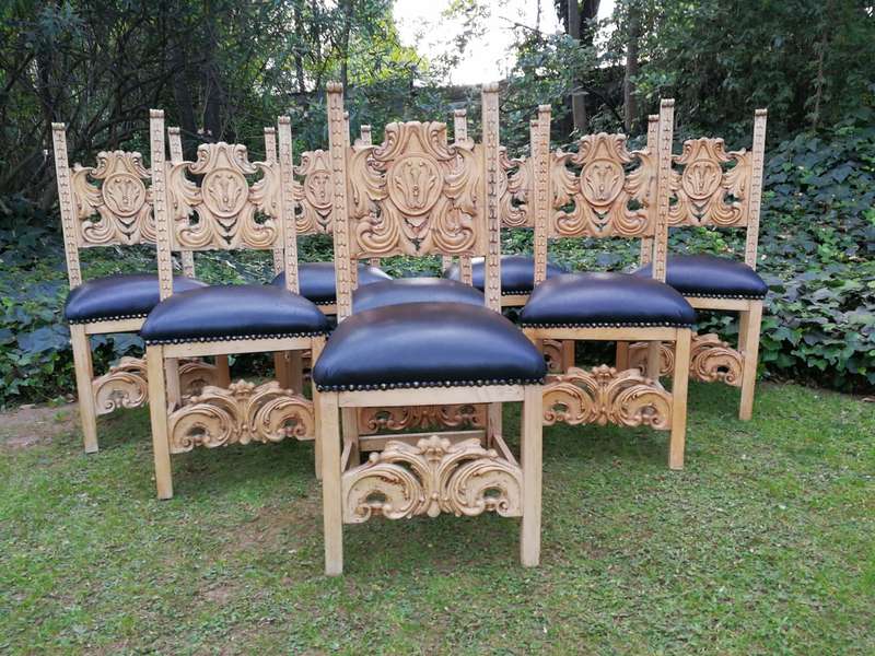 A 20th Century Set of Eight Carved and Bleached Oak Dining Chairs Upholstered in Leather