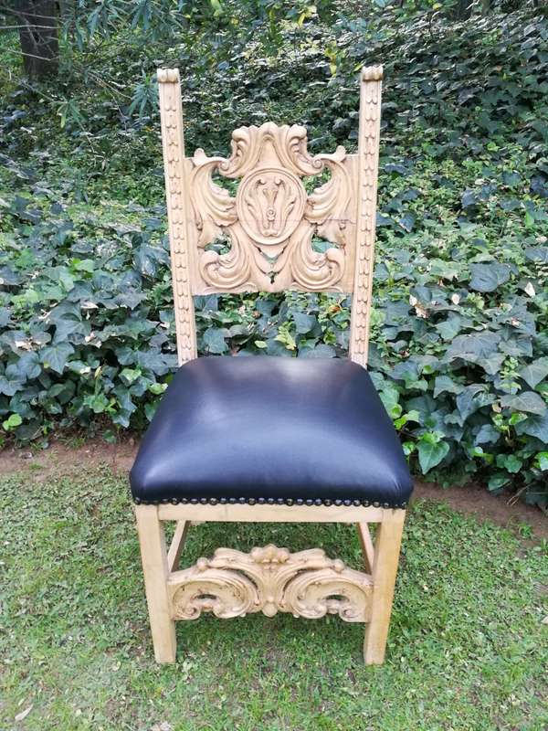 A 20th Century Set of Eight Carved and Bleached Oak Dining Chairs Upholstered in Leather