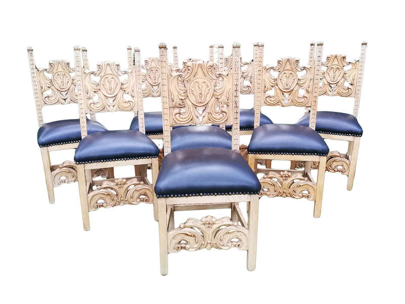 A 20th Century Set of Eight Carved and Bleached Oak Dining Chairs Upholstered in Leather