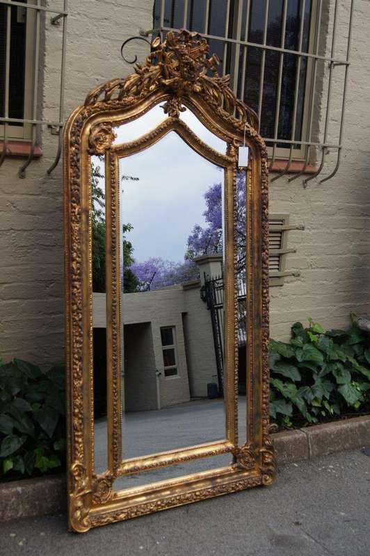 Ornate carved and gilded Bevelled mirror