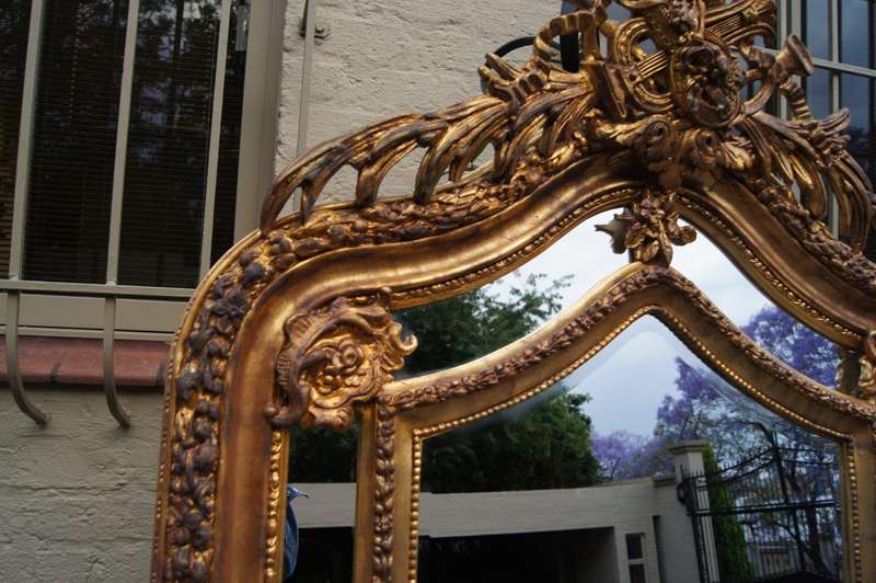 Ornate carved and gilded Bevelled mirror