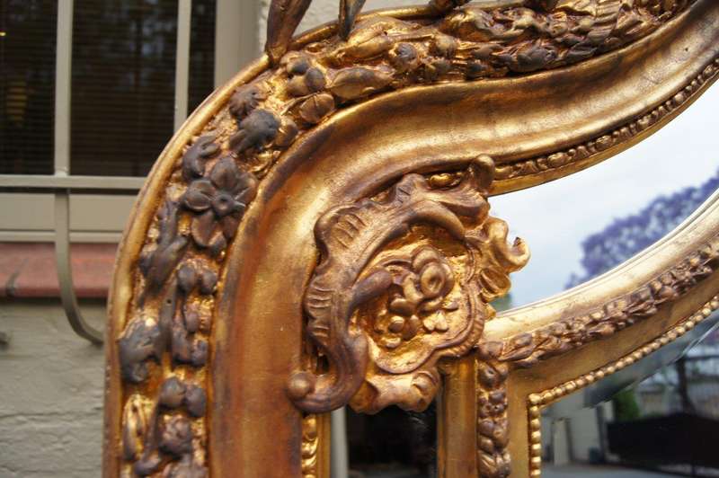 Ornate carved and gilded Bevelled mirror