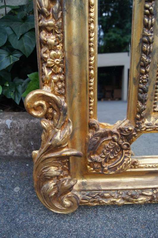 Ornate carved and gilded Bevelled mirror