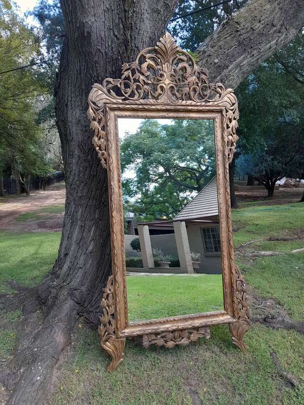 An Ornately Carved Wooden and Hand-Gilded Mirror of Large Proportion