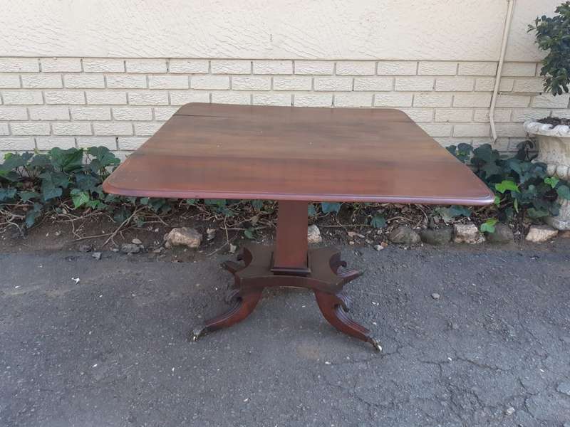 Regency Inlaid Mahogany Dropside Breakfast Table with Brass Capped Claw Feet on Castors