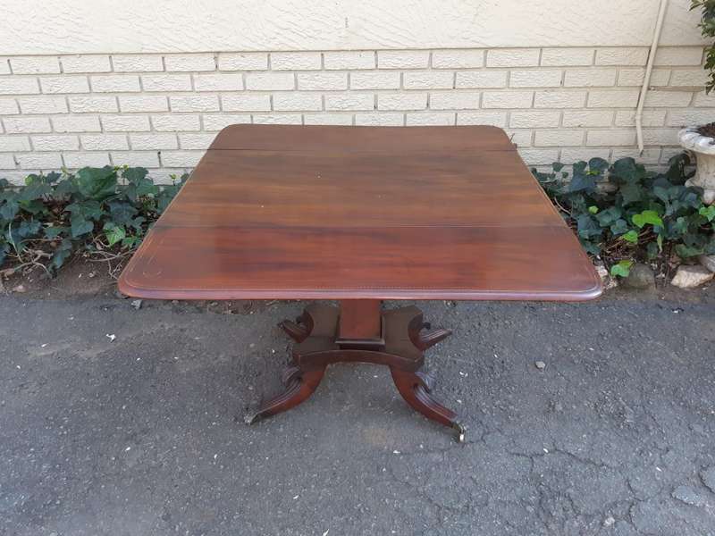 Regency Inlaid Mahogany Dropside Breakfast Table with Brass Capped Claw Feet on Castors