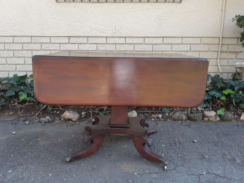 Regency Inlaid Mahogany Dropside Breakfast Table with Brass Capped Claw Feet on Castors