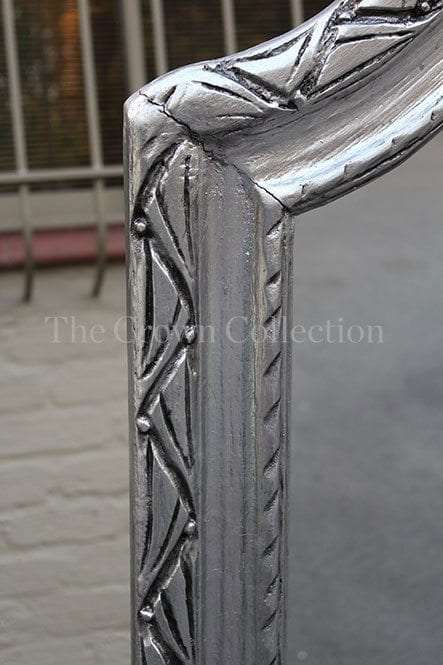 Tall ornate silver gilt mirror