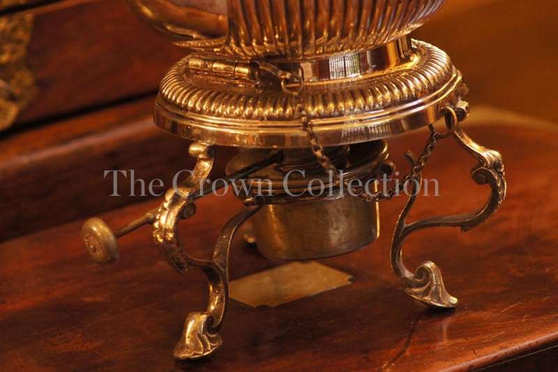 Silver plated tea pot on burner