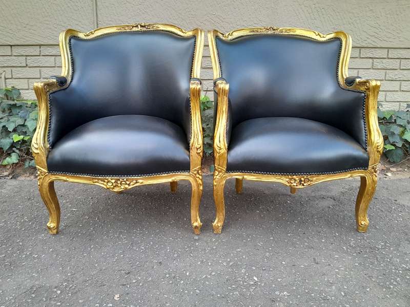 A 20th Century French Style Pair Of Carved Gilt Wood Armchairs