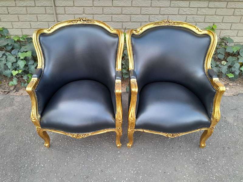 A 20th Century French Style Pair Of Carved Gilt Wood Armchairs