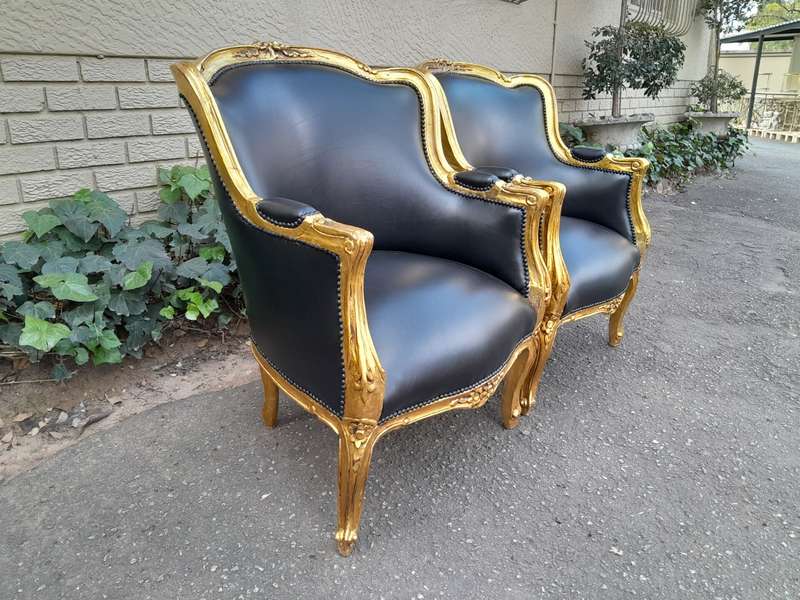 A 20th Century French Style Pair Of Carved Gilt Wood Armchairs