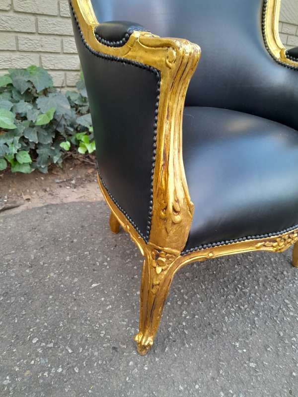 A 20th Century French Style Pair Of Carved Gilt Wood Armchairs
